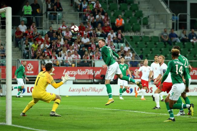 Republic of Ireland striker Aiden O’Brien (centre) scores in Poland